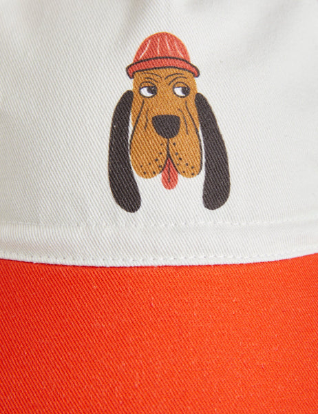 Cappello con visiera rosso e panna con stampa Bloodhound per neonati e bambini