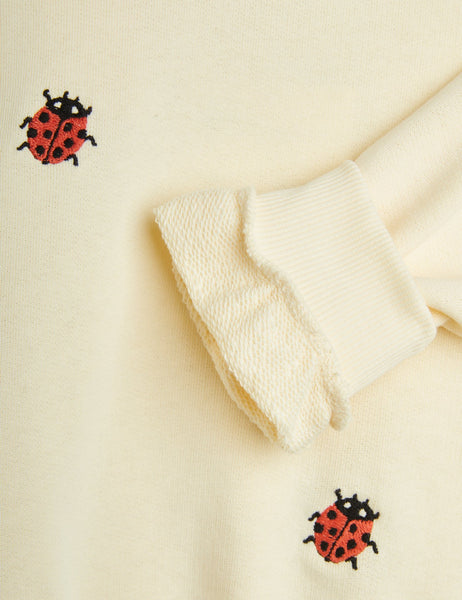 Felpa crema con coccinelle per neonata e bambina