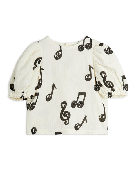 Blusa panna con note musicali per bambina