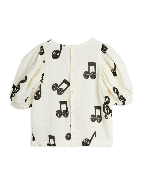 Blusa panna con note musicali per bambina