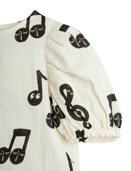 Blusa panna con note musicali per bambina
