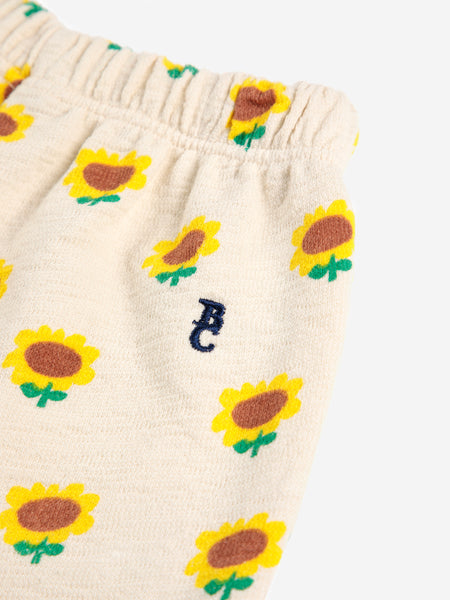Pantalone con stampa girasoli all over per neonata
