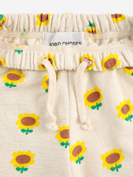Pantalone con stampa girasoli all over per neonata