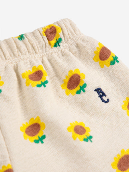 Pantalone con stampa girasoli all over per neonata