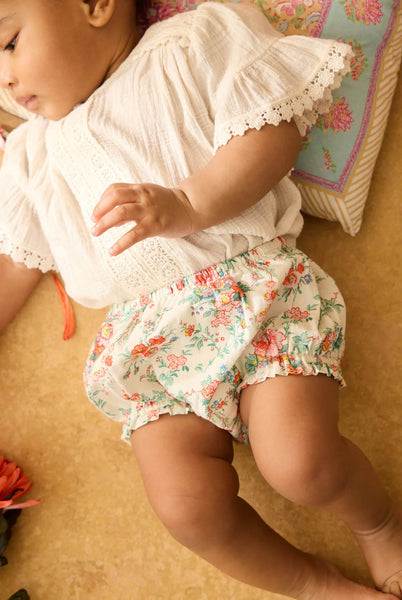 Culotte con stampa fiori all over per neonata
