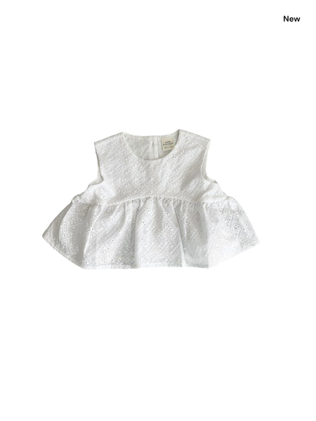 Top bianco con ricami all over per neonata