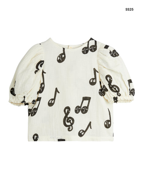 Blusa panna con note musicali per bambina