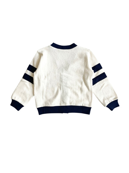 Cardigan panna con dettagli blu per neonato e bambino