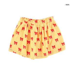 Gonna in spugna gialla con fiocchi rossi per bambina