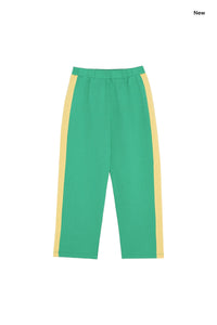 Pantalone in felpa verde con banda gialla per bambini