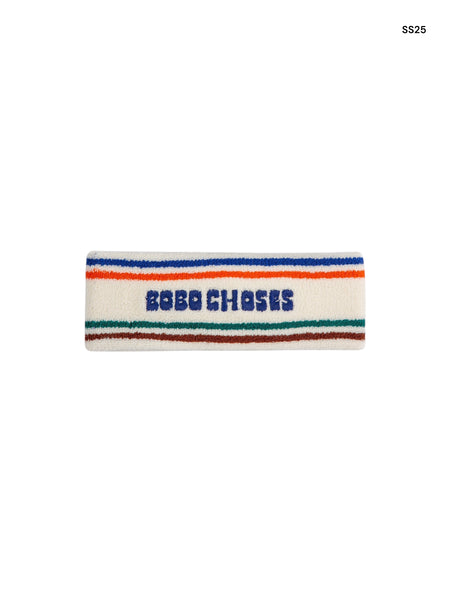 Fascia in spugna bianca con righe multicolor e logo per bambini