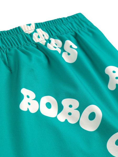 Costume verde con logo all over per neonato e bambino