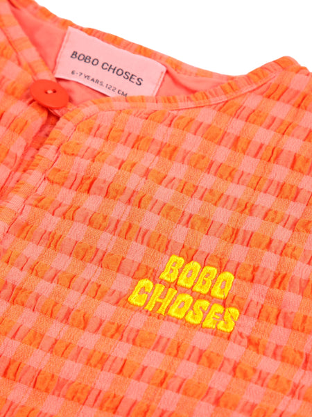 Giacca imbottita vichy arancio e fucsia per neonata e bambina