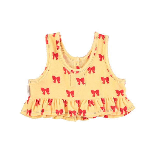 Top in spugna giallo con fiocchi rossi per bambina