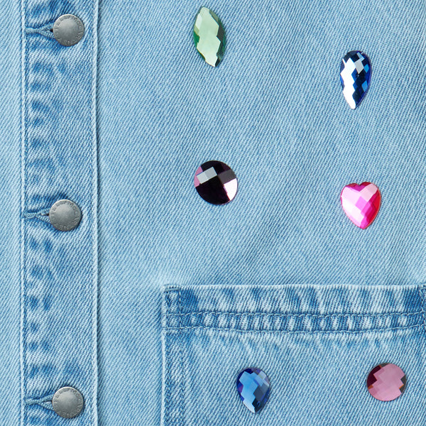 Salopette in denim celeste con pietre per bambina
