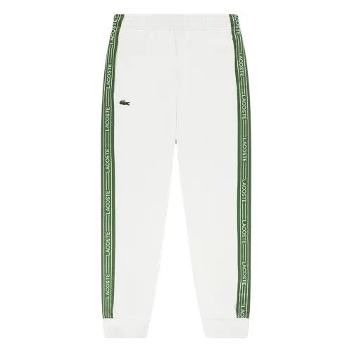 Pantalone in felpa bianco con logo per bambino Lacoste 947579 70V 
