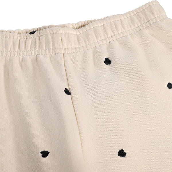 Pantalone beige in felpa con cuori ricamati all over per neonata e bambina Molo ANNA 9536 