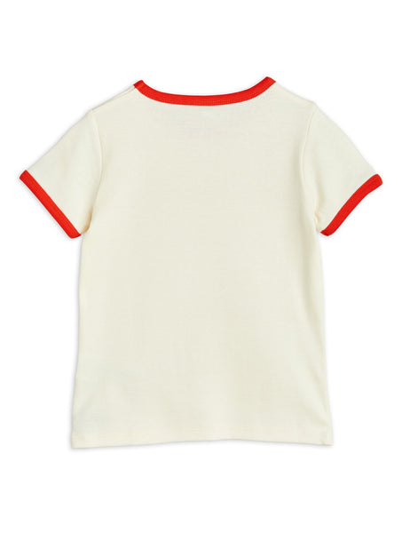 T-shirt panna con dettagli rossi per neonati e bambini
